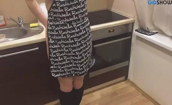 Seductive MILF in stilettos masturbates passionately in the kitchen
